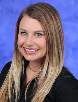 Professional head and shoulders photo of Trina Sholly