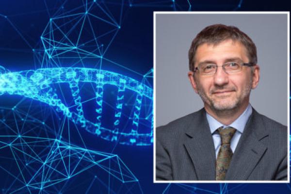 A head and shoulders professional portrait of Nikolay Dokholyan against a background, abstract image of genetic material.